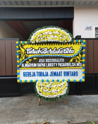 Papan Bunga Duka di Dlimoyo